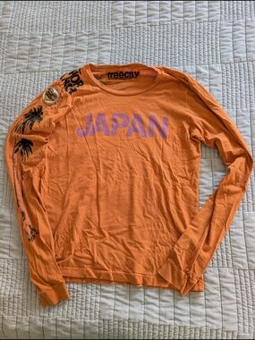 freecity Orange Tee with Black Logo Patch